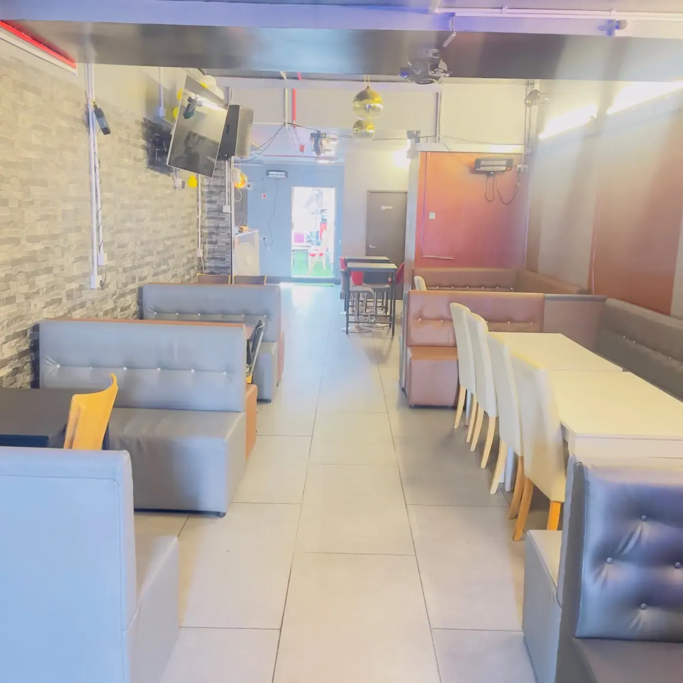 Booth seating inside 042 Restaurant and Bar
